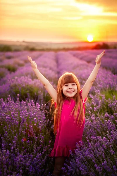 happy girl running in lavender field