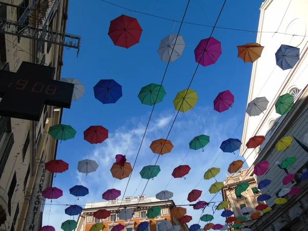 Beautiful coloured umbrellas over the city of Genova for the Euroflora event