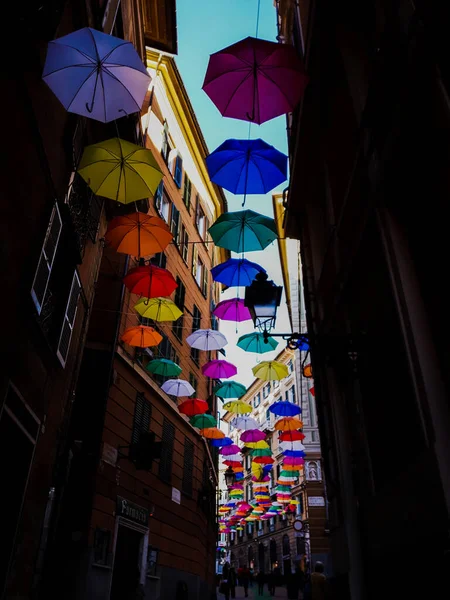 stock image Genova, Italy - 0/29/2020: Multicolored umbrellas against the sky, street decorated. LGBT flag. Rainbow love concept. Human rights and tolerance.