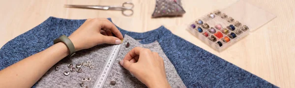 Tailoring. Seamstress at work. Installation of furniture.