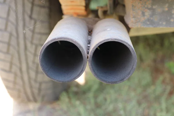A car dual exhaust pipe on old car with  high power engine