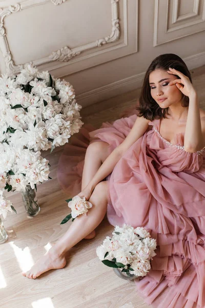 Girl Sitting Floor Lush Pink Dress Surrounded Fresh Peonies — Stock Photo, Image