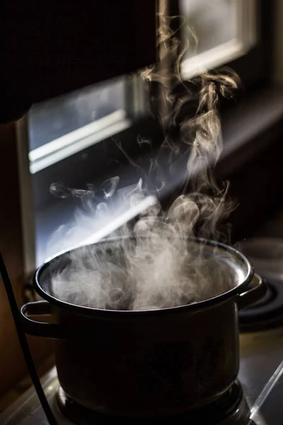 steam from the pan in the kitchen