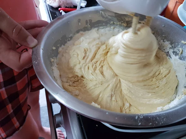 mixer mix flour dough for sweet cake in the kitchen