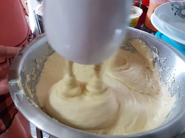 mixer mix flour dough for sweet cake in the kitchen