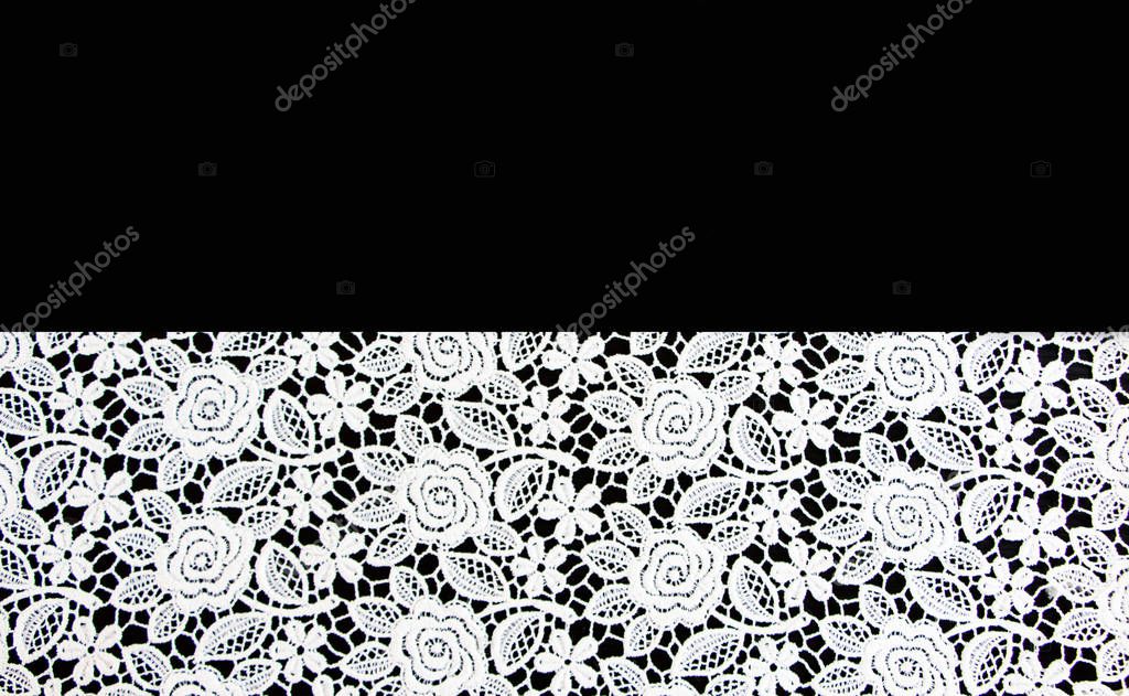 White lace on black background 