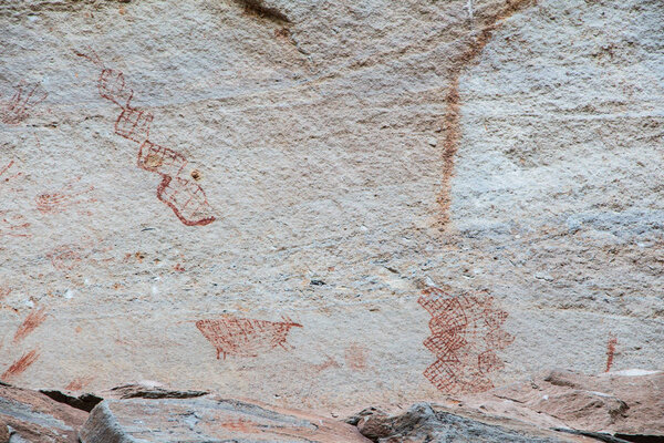 Abstract human art at Pha Taem prehistoric cliff painting which 