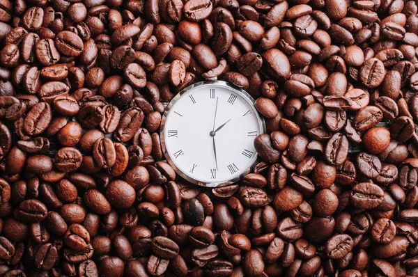 wristwatch face in brown coffee beans