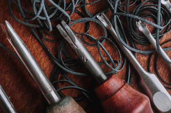 close up of handcraft leather tools and leather ropes
