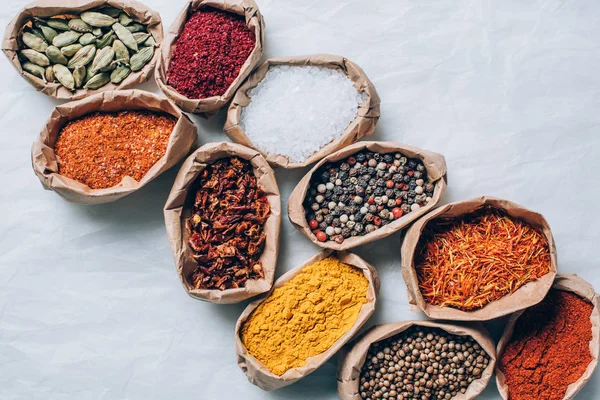 Top View Colorful Spices Paper Bags White Table — Stock Photo, Image