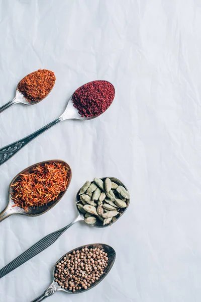 Top View Dry Spices Spoons White Table — Free Stock Photo