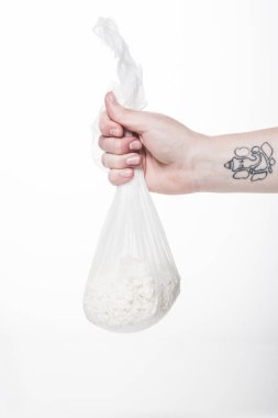 cropped shot of woman holding cheesecloth sack with cottage cheese isolated on white clipart