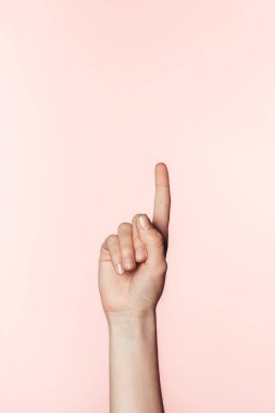 cropped image of woman doing finger raised gesture isolated on pink background  clipart