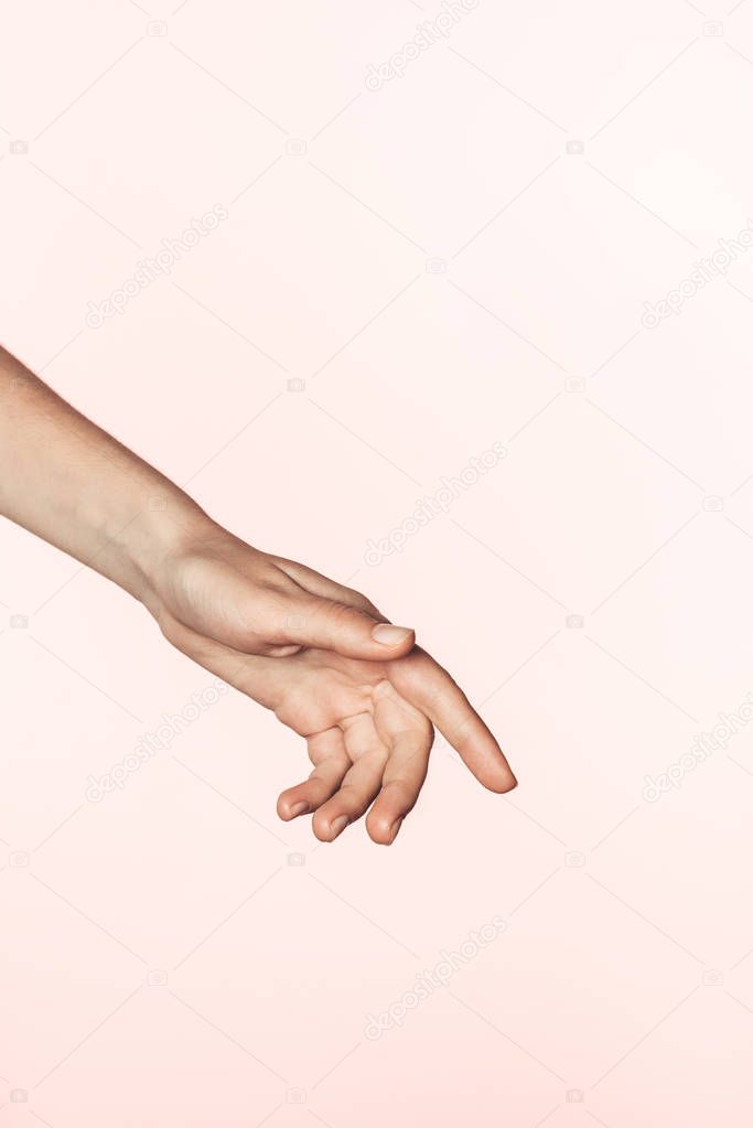 cropped image of woman gesturing by hand isolated on pink background 