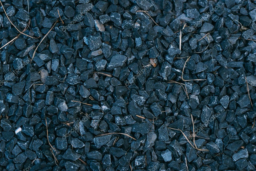 Close up of background with black stones or gravel