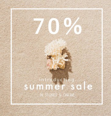 top view of coral lying on sandy beach with summer sale sign clipart