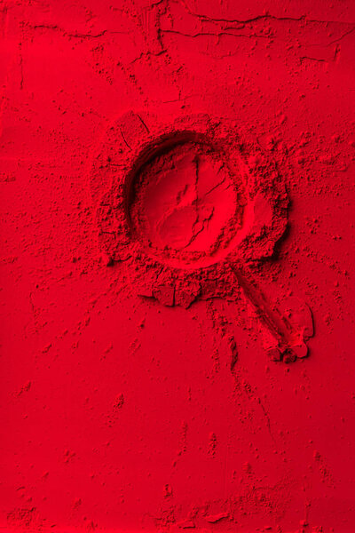 top view of lollipop shape on red powder