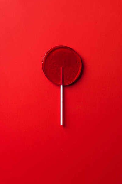 Top View One Lollipop Red Surface Stock Image