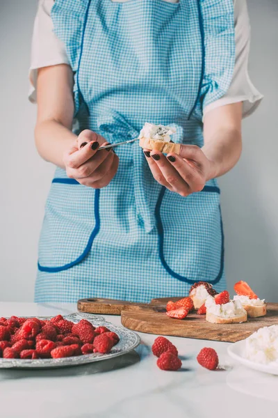 Cropped Shot Woman Apron Spreading Cream Cheese Baguette Table Strawberries — Stock Photo, Image