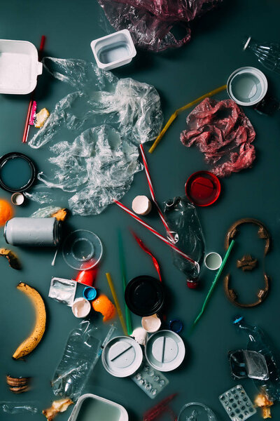 top view of trash and leftovers flowing in water, environment protection concept