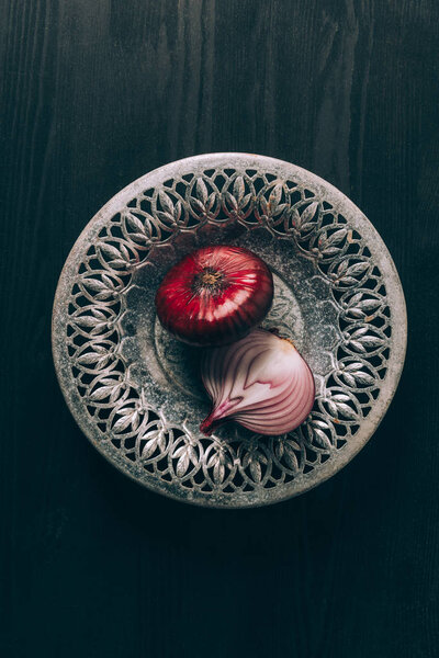 top view of red onions on grey plate