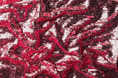 top view of burgundy textile with shiny sequins as background  clipart