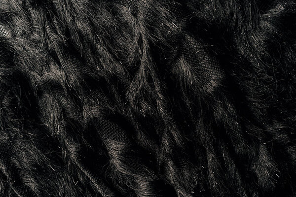elevated view of furry black textile as background 