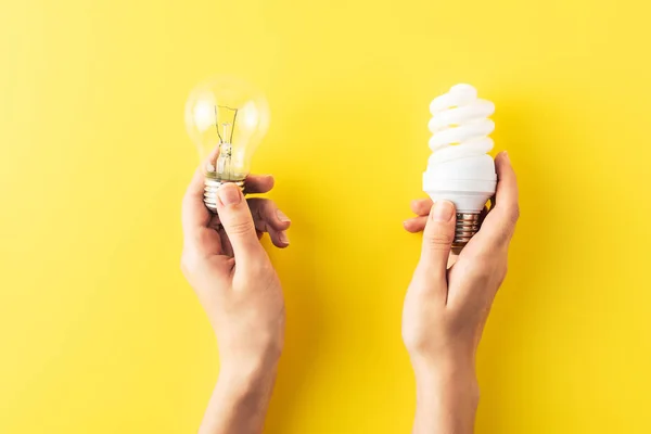 Cropped Shot Person Holding Different Types Light Bulbs Yellow — Stock Photo, Image