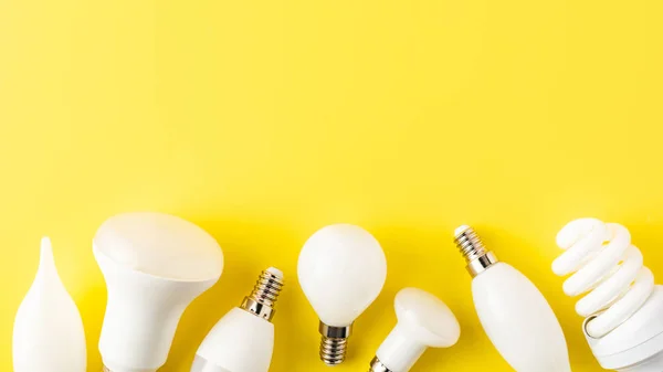 Vista Primer Plano Varios Tipos Lámparas Sobre Fondo Amarillo — Foto de Stock