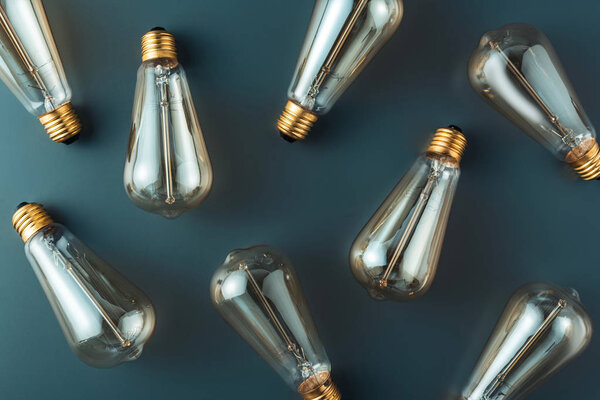top view of light bulbs on grey background, energy concept