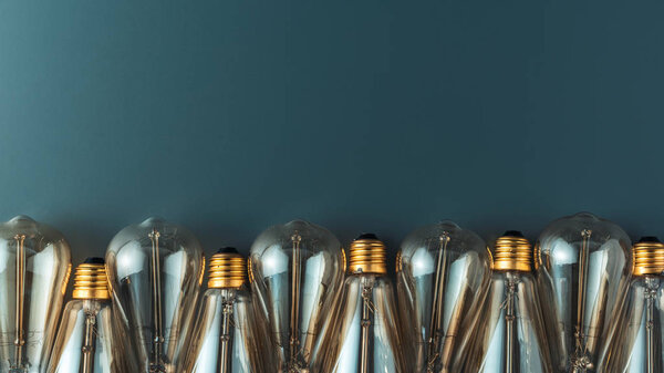 close-up view of light bulbs in row on grey background