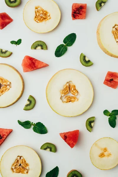 Top View Juicy Melon Watermelon Kiwi Slices Mint Leaves Grey — Stock Photo, Image
