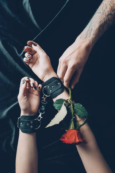 Cropped Shot Woman Black Leather Handcuffs Man Holding Red Rose — Stock Photo, Image