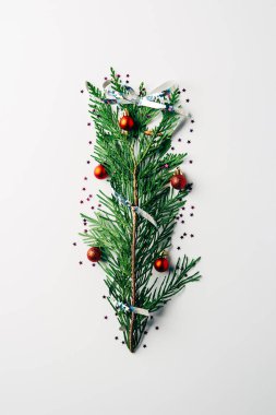 top view of green pine branch decorated as festive christmas tree on white background clipart