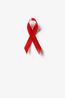 top view of aids awareness red ribbon on white background clipart