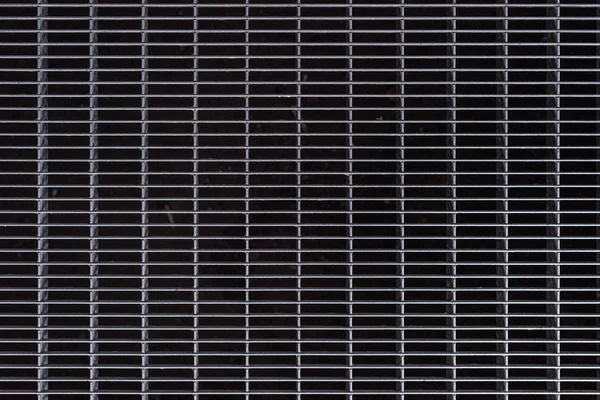 full frame image of grey metal cage background