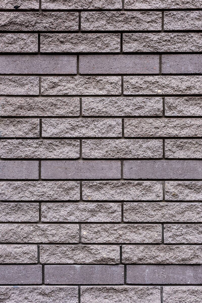 full frame image of grey stone wall background 