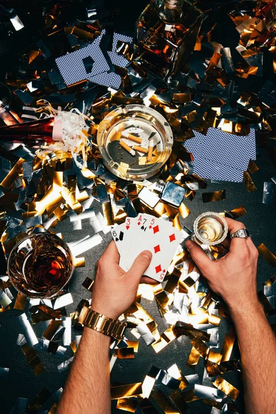 Partial View Man Playing Cards Alcohol Sitting Table Covered Golden — Stock Photo, Image