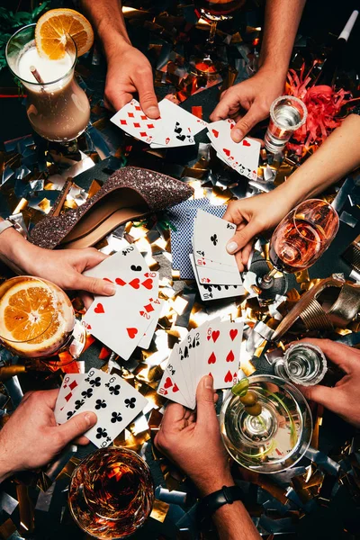 Cropped Shot Friends Alcoholic Cocktails Playing Poker Table Covered Golden — Stock Photo, Image