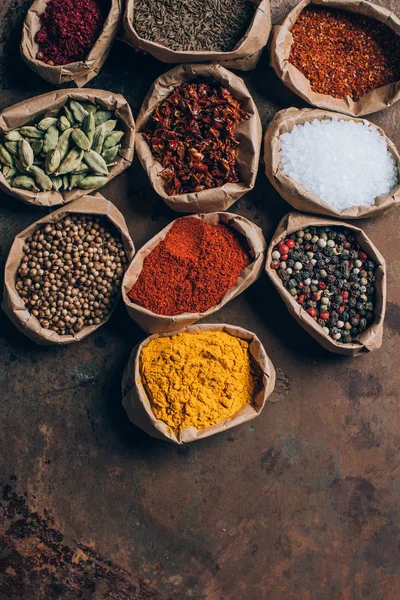 Top view of indian spices in paper bags on table — Stock Photo