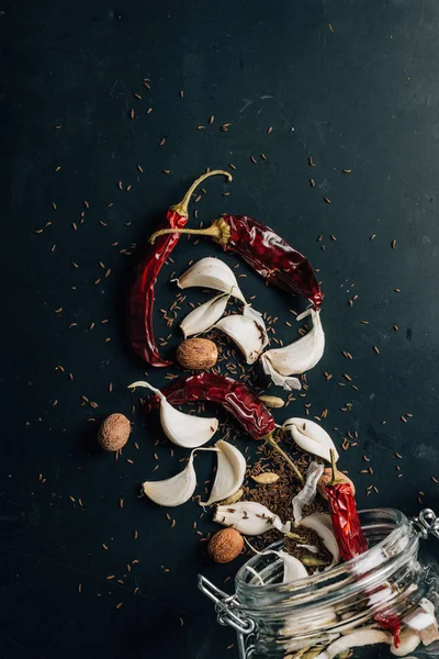 Top view of chili peppers and garlic on table — Stock Photo