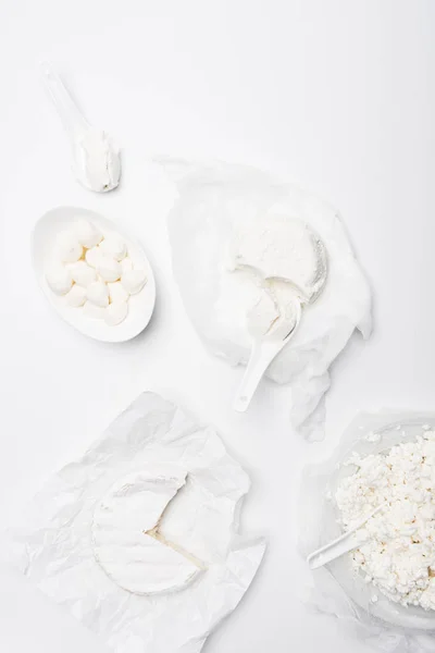 Top view of various milk products on white surface — Stock Photo