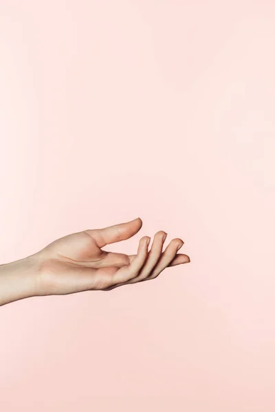 Partial view of woman gesturing by hand isolated on pink background — Stock Photo