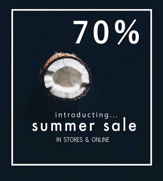 Half of tasty healthy coconut isolated on black with summer sale lettering — Stock Photo