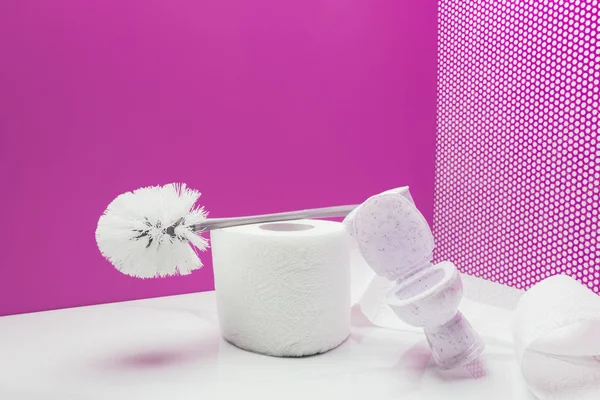 Toy toilet with real size toilet brush and paper roll in miniature room — Stock Photo