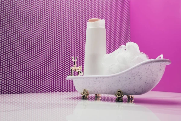 Toy bath with real size shampoo bottle and bast in miniature room — Stock Photo