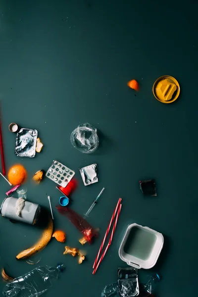 Top view of garbage and leftovers flowing in water, ecology protection and recycle concept — Stock Photo