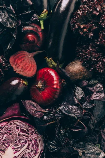 Top view of red cabbage, aubergines and beetroots on table — Stock Photo