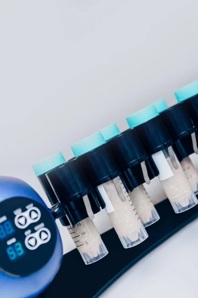 Selective focus of tubes with reagents in modern biotechnology laboratory — Stock Photo