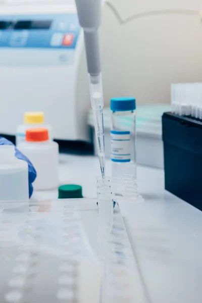 Selective focus of pipette in modern biotechnology laboratory — Stock Photo